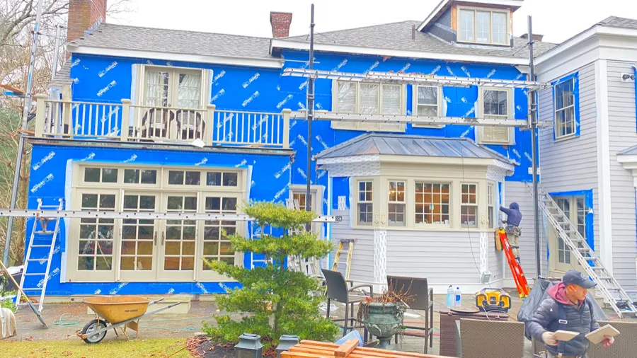 Large-scale home renovation project with scaffolding